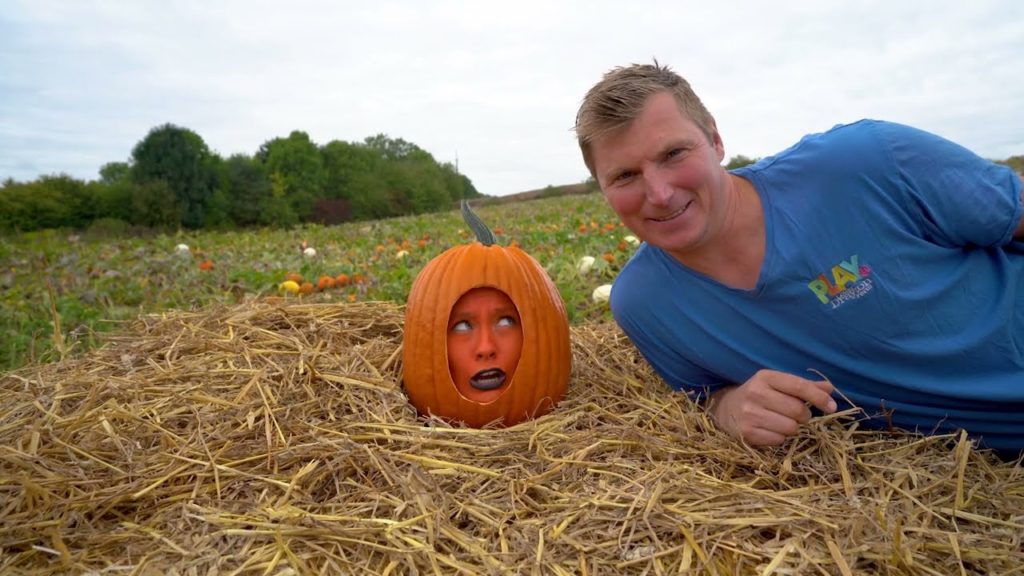 Woman dressed as pumpkin and farm owner Ray Bower from promotional video